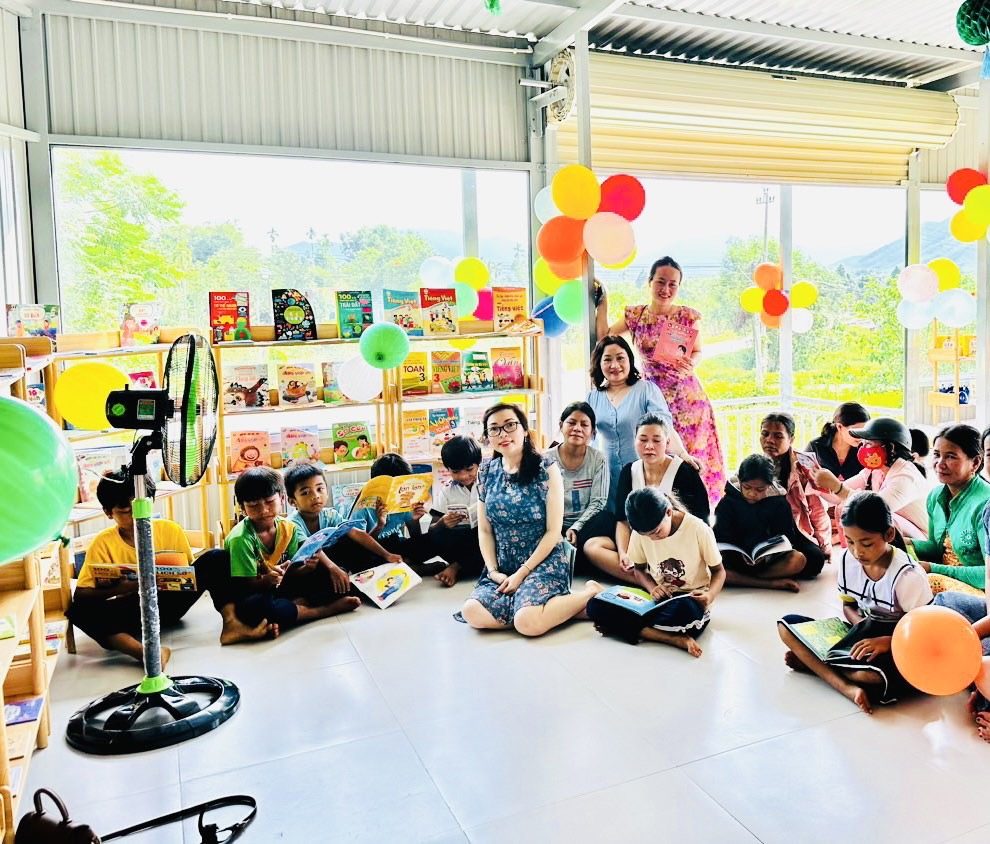 Children and community members participating in a PlanVN activity